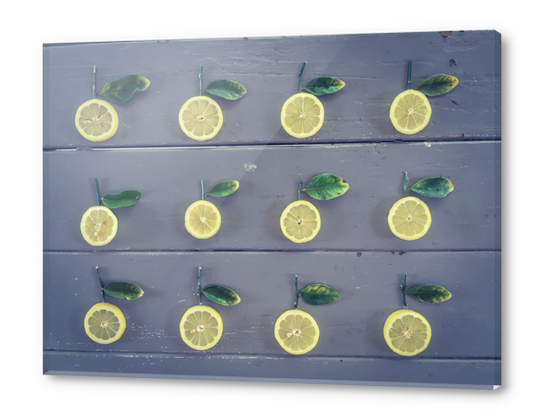 pieces of lemon on the wooden table Acrylic prints by Timmy333
