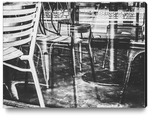 outdoor chairs in the city in black and white Canvas Print by Timmy333