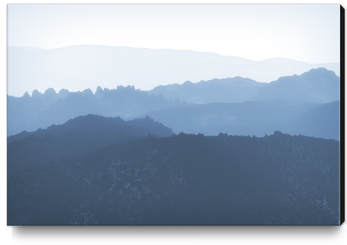 Mist Covered Mountains Canvas Print by cinema4design
