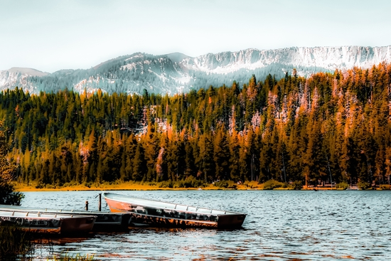 boat on the lake with pine tree and mountain background at Mammoth Lakes, California, USA by Timmy333