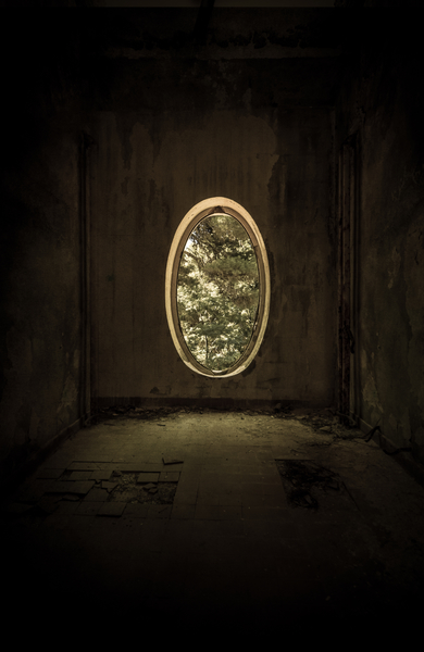Old forgotten room with oval window by Jarek Blaminsky