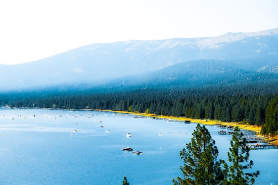 boats on the blue lake with pine tree and mountains at Lake Tahoe, Nevada, USA by Timmy333