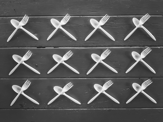 plastic forks and plastic spoons in black and white by Timmy333