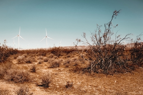 Desert and wind turbine with blue sky at Kern County California USA Mural by Timmy333
