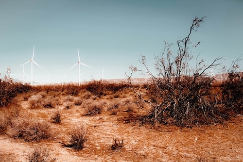 Desert and wind turbine with blue sky at Kern County California USA Mural by Timmy333