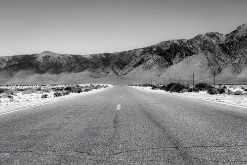 road trip in the desert land in California in black and white Mural by Timmy333