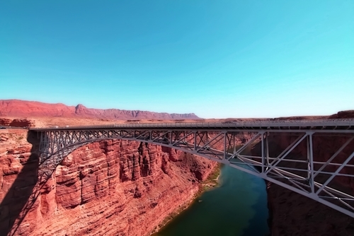 bridge over the river in the desert with blue sky in USA Mural by Timmy333