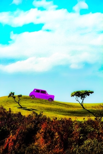 pink classic car on the green mountain with cloudy blue sky Mural by Timmy333