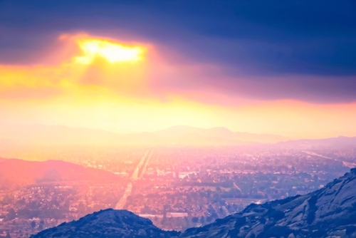 light of the sunset sky over the city in summer Mural by Timmy333