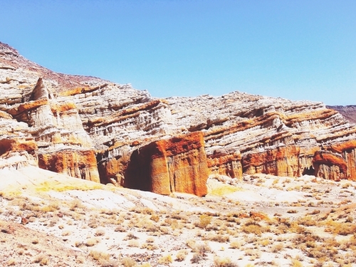sand desert with orange mountain in California, USA with summer blue sky Mural by Timmy333
