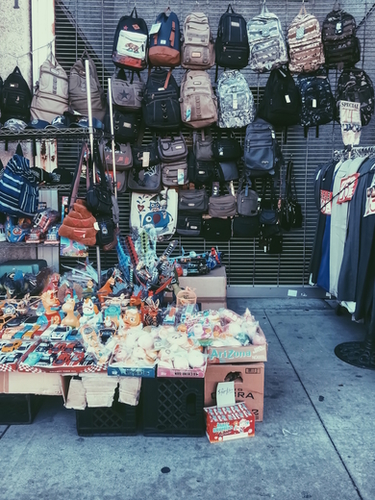backpack and toy shop on the footpath Mural by Timmy333
