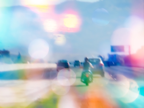 car and motorcycle on the road in the city with bokeh light Mural by Timmy333