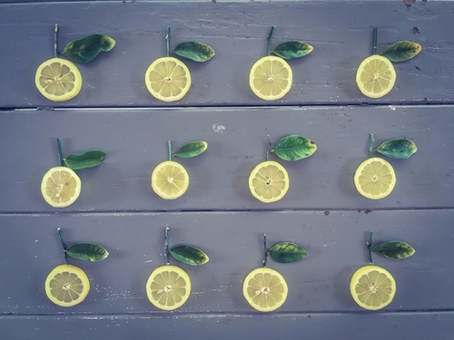 pieces of lemon on the wooden table Mural by Timmy333