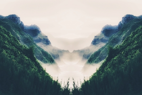 green mountains with ocean view and foggy sky Mural by Timmy333