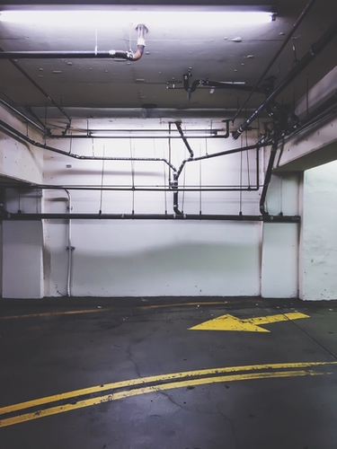 parking lot with the yellow arrow and tubes Mural by Timmy333